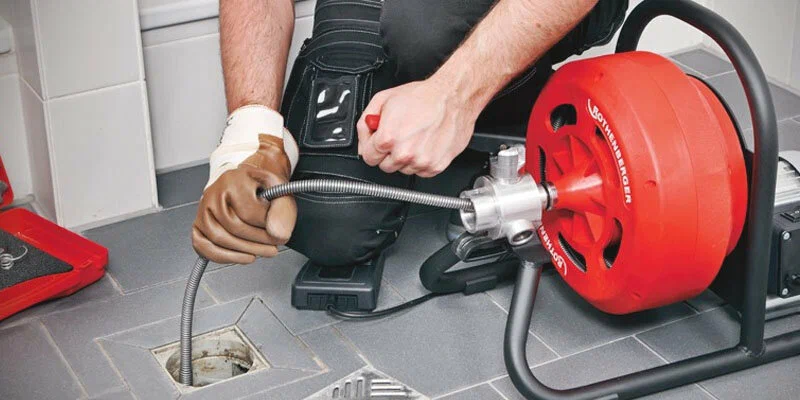 Drain cleaning service in Woodstock, Georgia using professional plumbing equipment