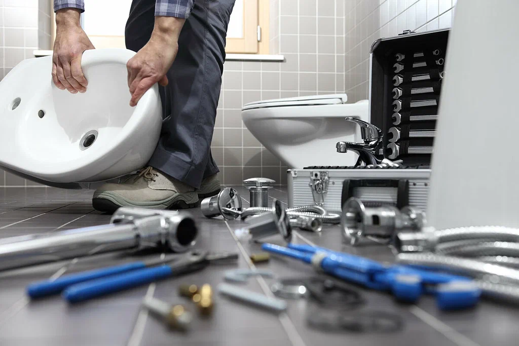 Plumbing tools prepared for a bathroom repair in Woodstock